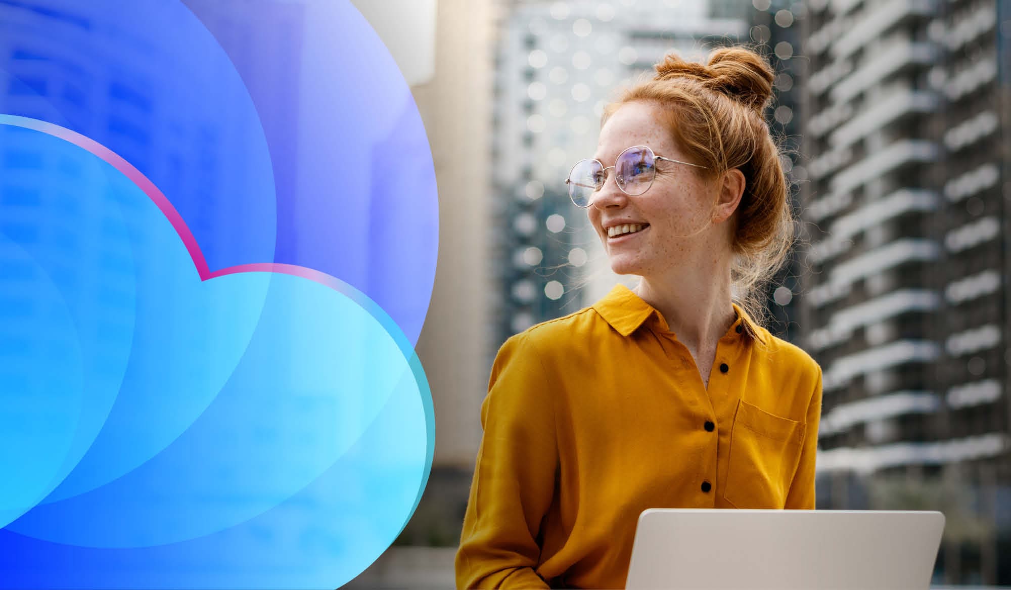 A smiling woman using cloud services on a laptop