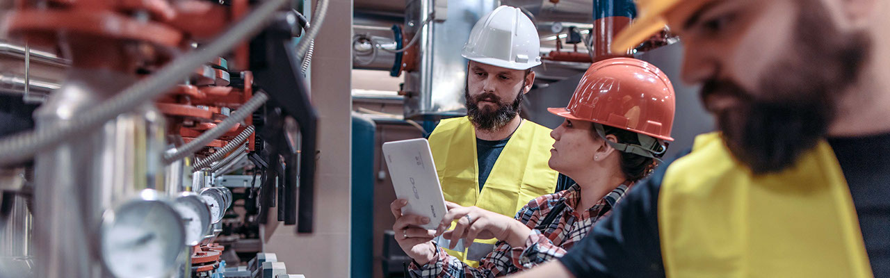 Construction workers use a digital tablet on-site