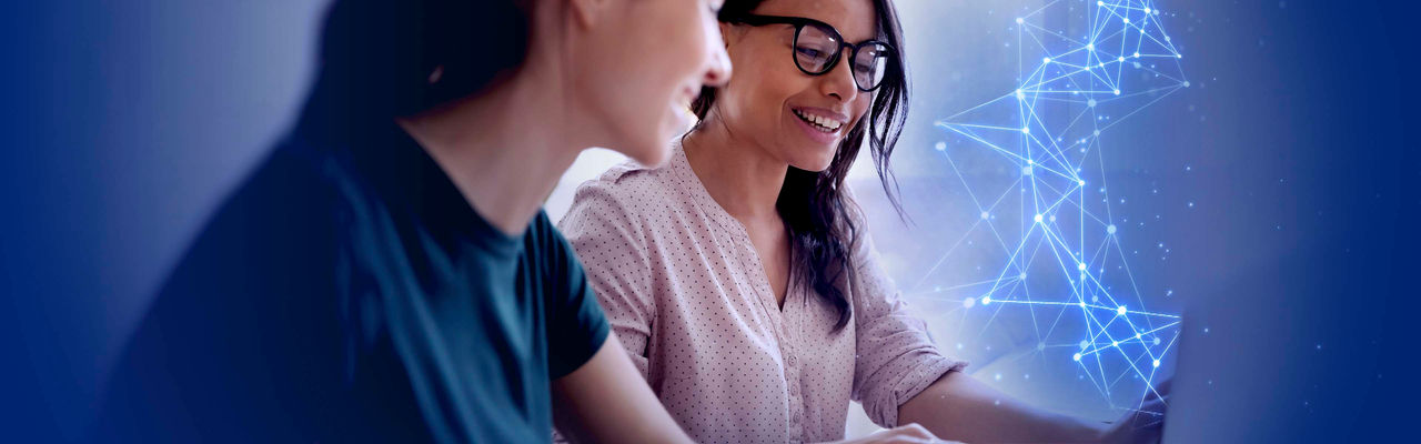 Two female cloud experts having a discussion surrounded by connecting lines