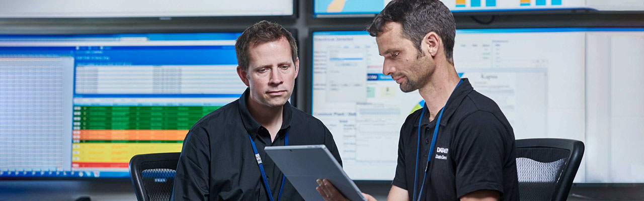 Two Datacom employees having a discussion in a data centre