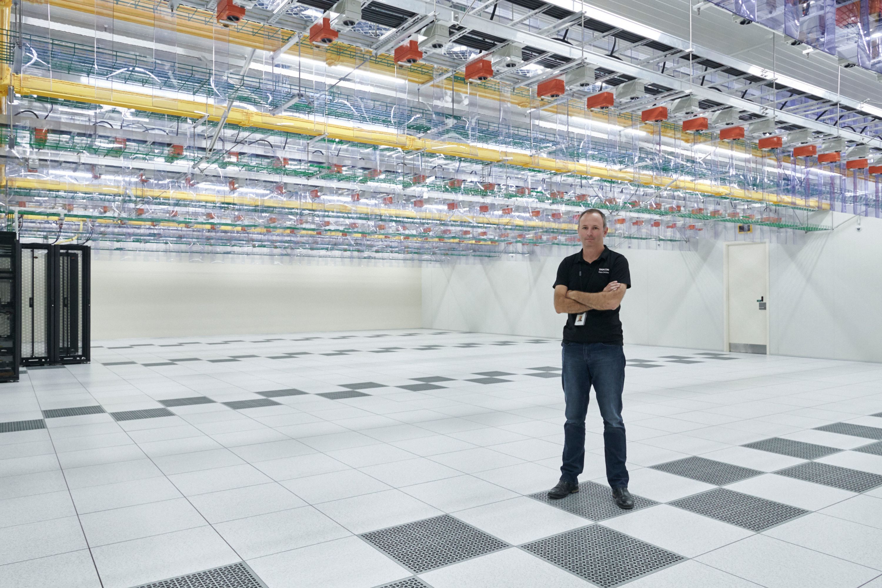 Man standing inside data centre