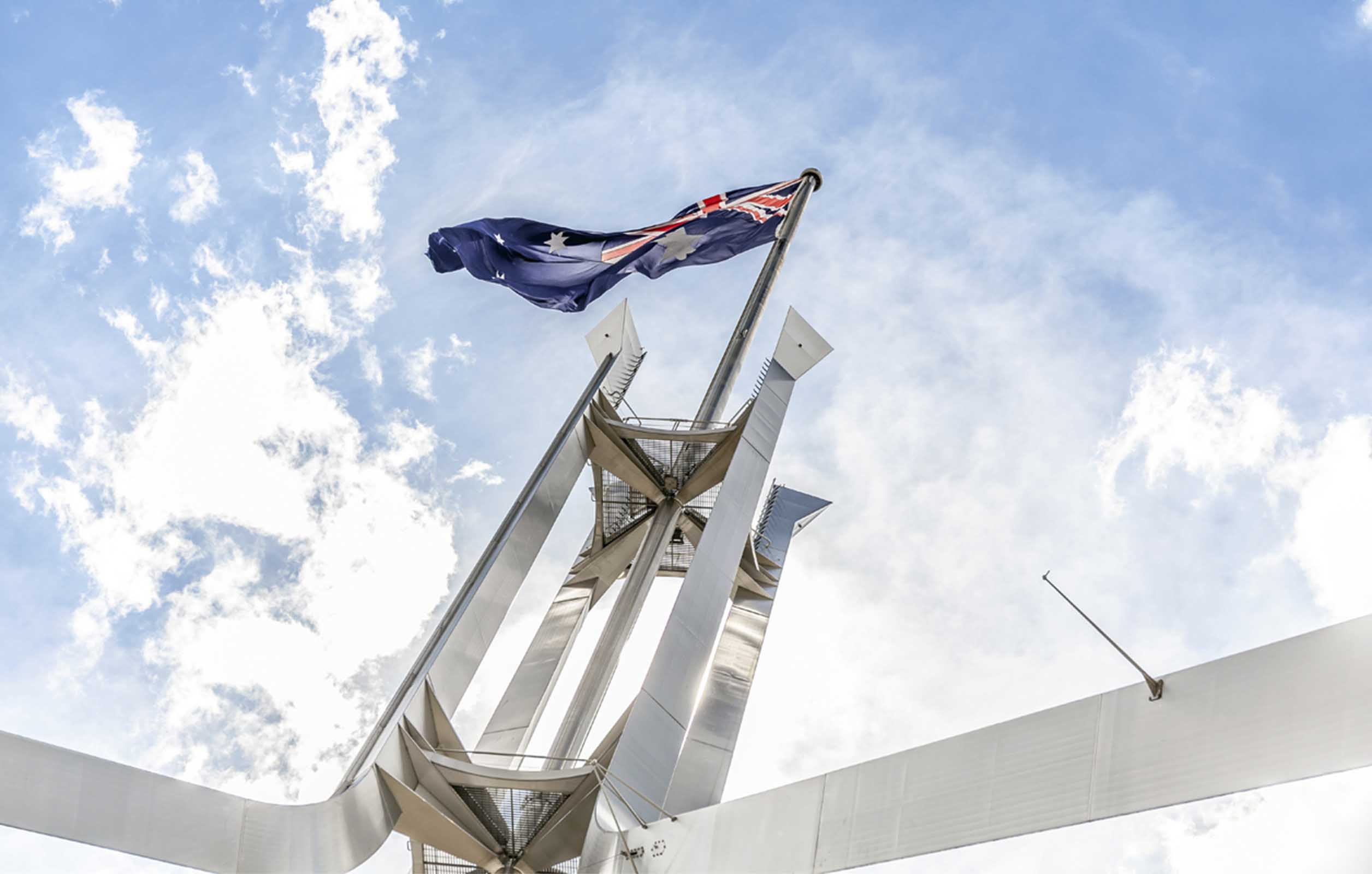 A low angle shot of the Australian flag flying