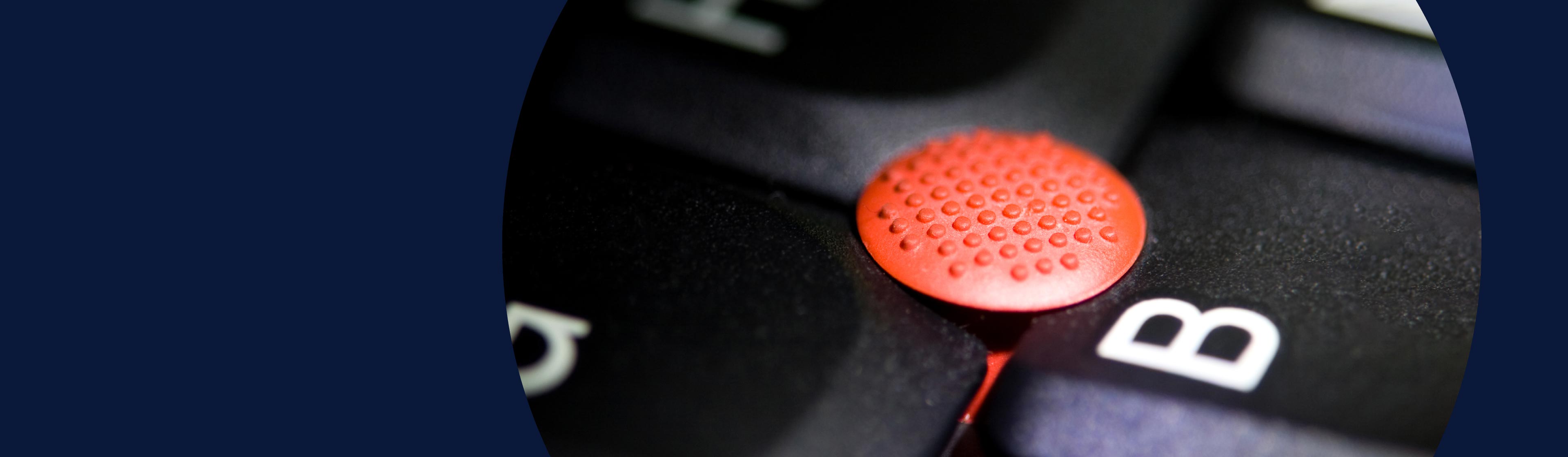 Close up shot of the TrackPoint on a Lenovo ThinkPad laptop