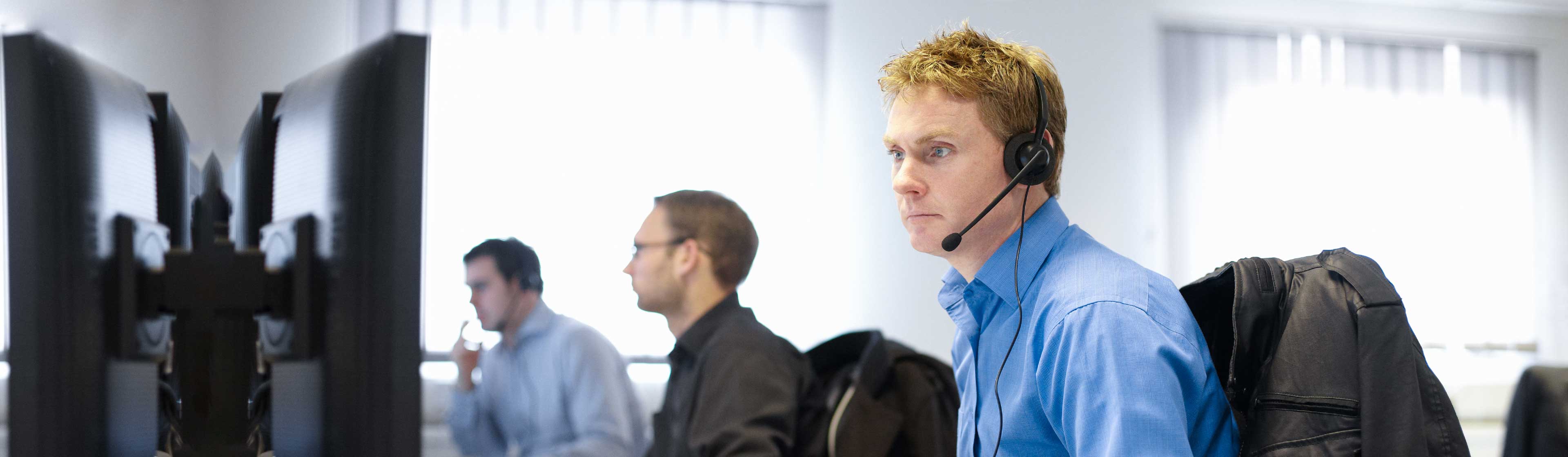 A man in an office on an IT support call