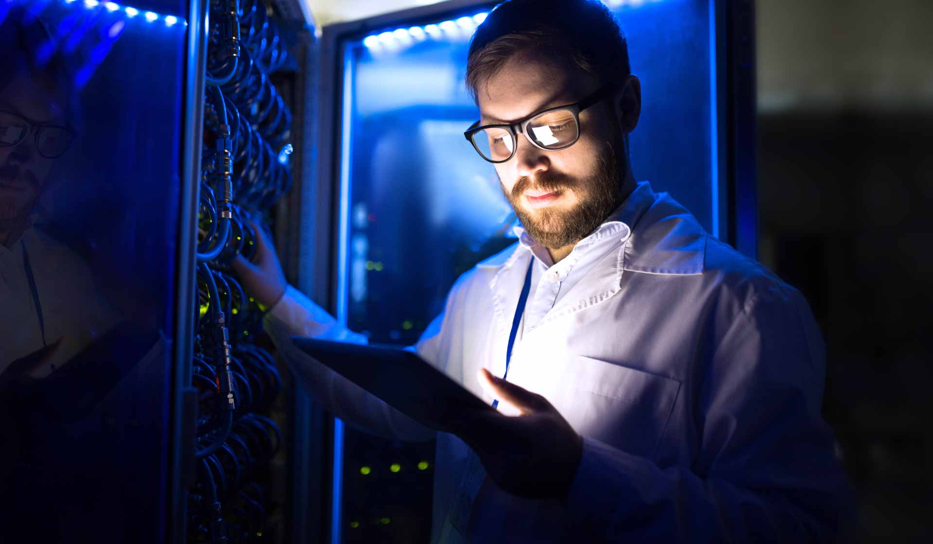 A man using a self service portal in a data centre
