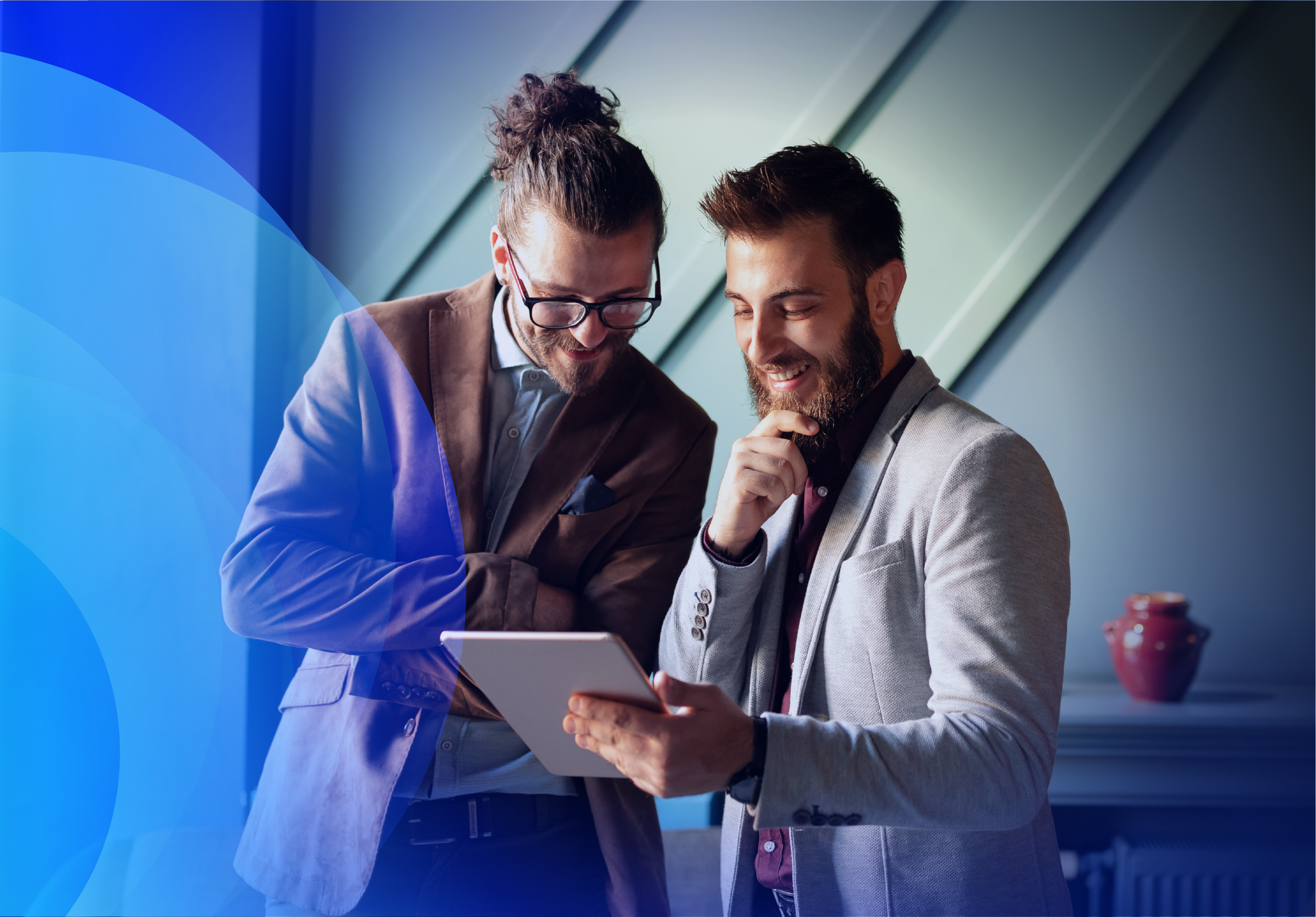 Two experts reviewing analytics on a tablet