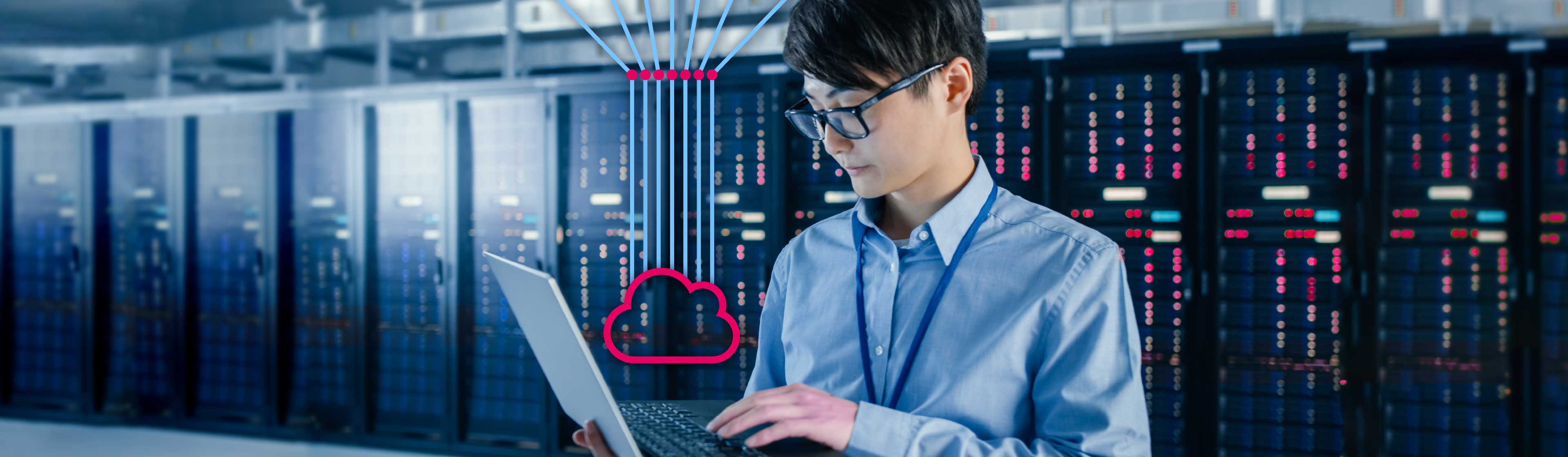 A cloud specialist wearing glasses using a laptop to manage a cloud server