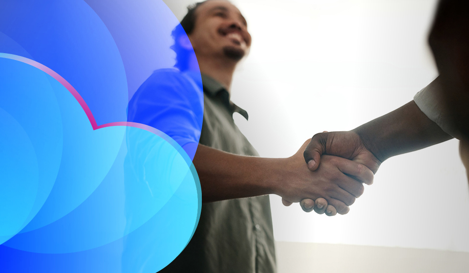 A man shaking hands with an unknown person