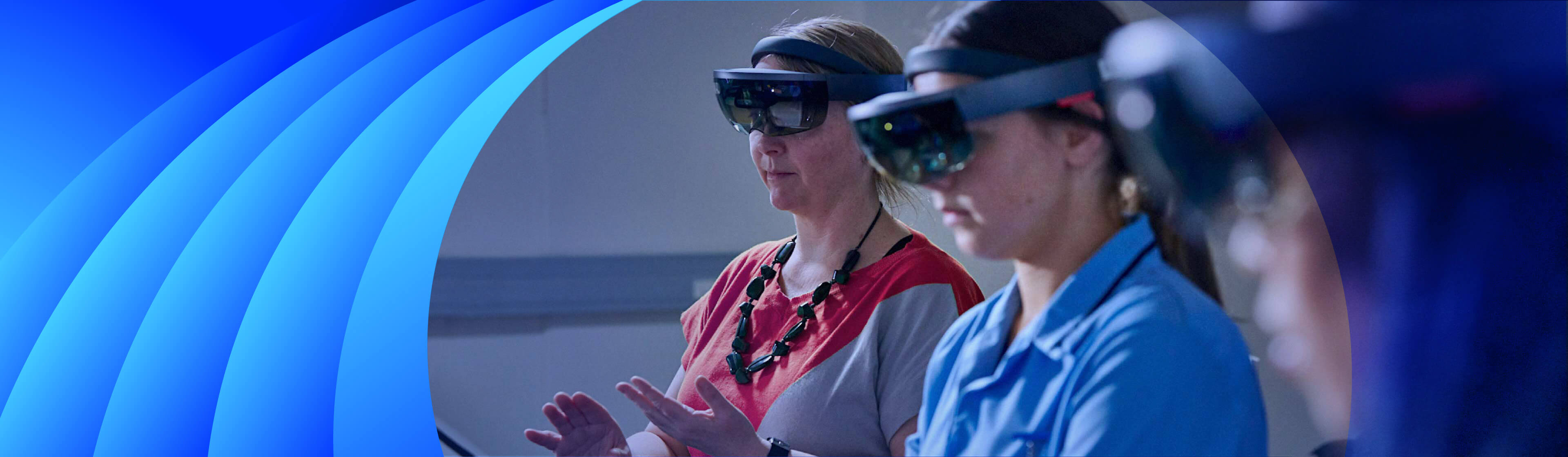 A female teacher and student using VR headsets