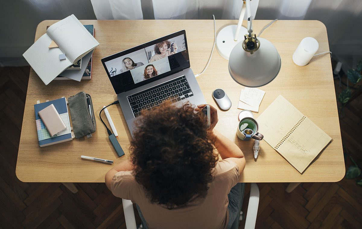 Woman on a video call with her team while working from home