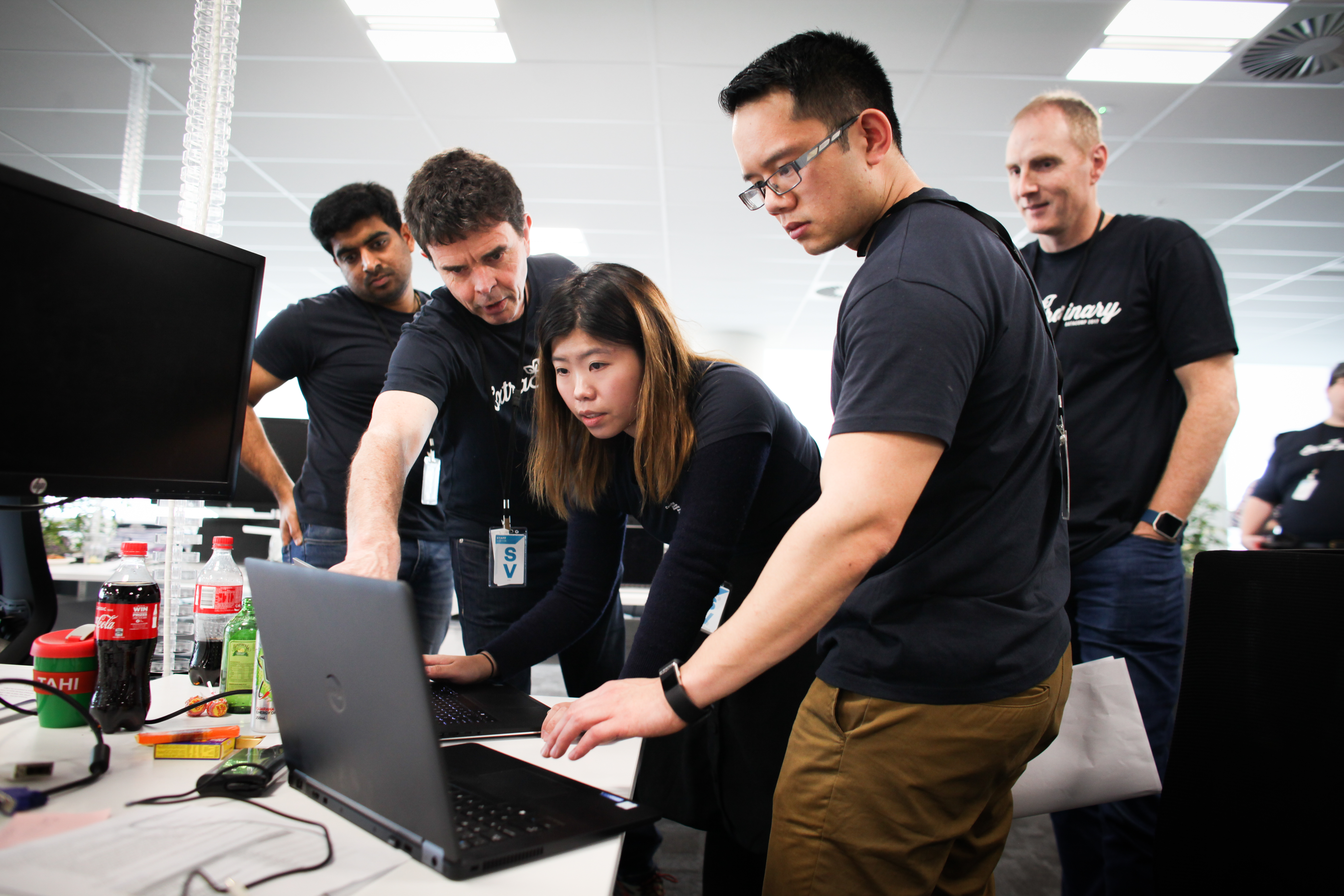 group of students looking at a computer