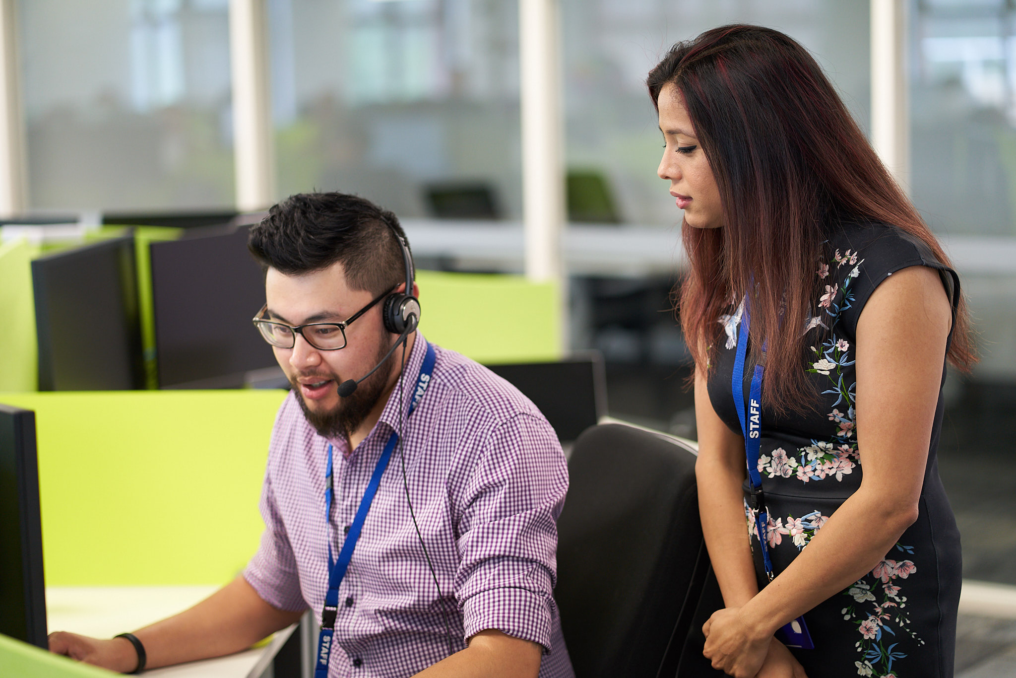 A man and a woman working together in an office