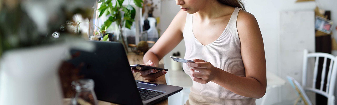 A young woman using her mobile banking app