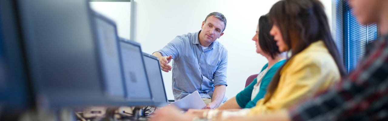 A corporate team undertaking IT training