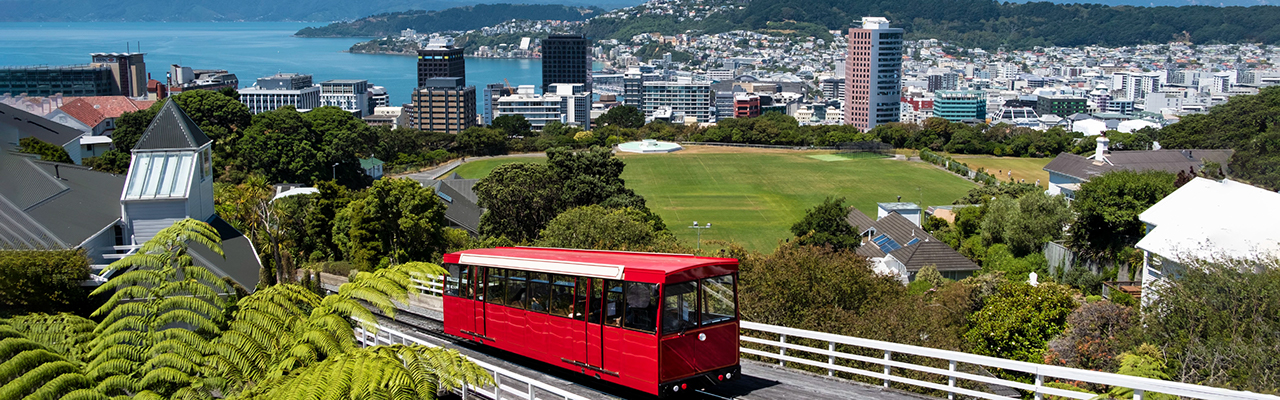 An overview of central Wellington, New Zealand with the cable car front and center