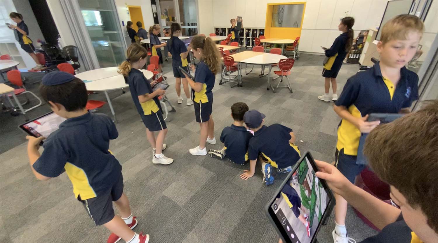 Schoolchildren using Apple iPads in a classroom